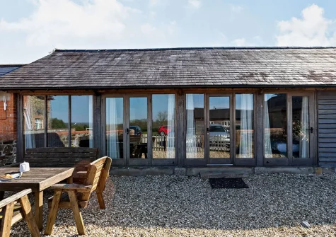 The patio & alfresco dining area at The Root House, North Nethercleave Farm, Umberleigh
