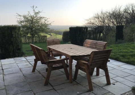The patio & far reaching countryside view at The Roundhouse, West Anstey