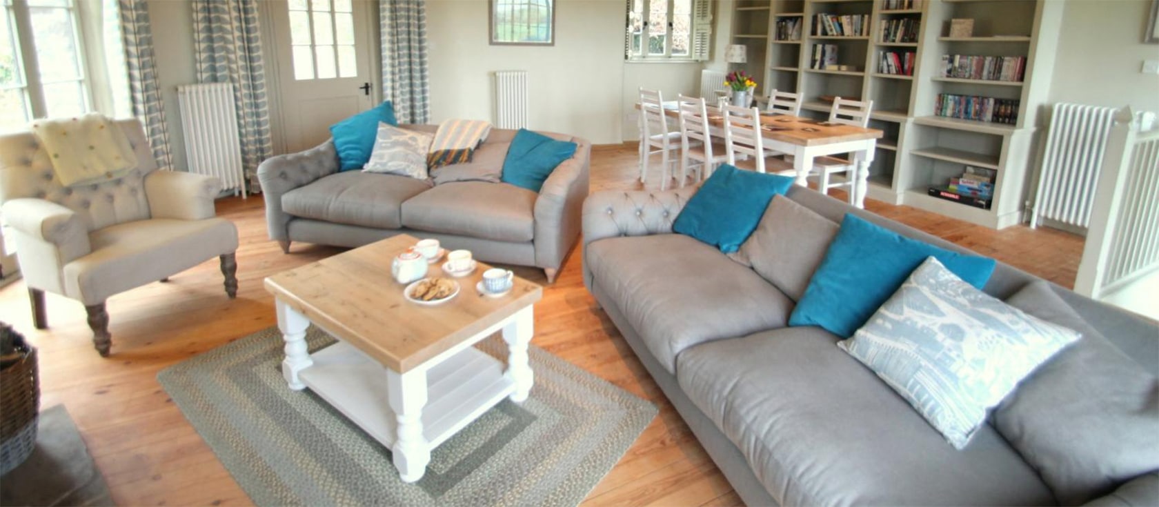The Roundhouse, West Anstey is a unique three bedroom, three bathroom converted barn on Exmoor with spacious circular living room, logburner & modern kitchen with island & dishwasher. Enclosed gardens, stunning views, farm animals & walks from the door.