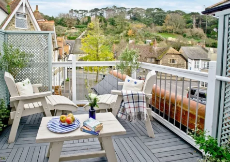 The balcony & outdoor sitting area at The Sail Loft, Beer