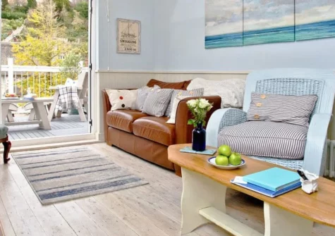 The Sail Loft, Beer is a charming cottage in a picture-perfect fishing village on Devon's Jurassic Coast, featuring a private balcony, period character with modern comforts, and the famous horseshoe beach just 100 metres from your door.