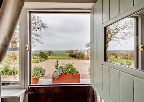 Step out through the front door to the front patio & garden