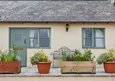 The front patio & outdoor sitting area at The Shippon, Hembury Gate Farm, Sheepwash