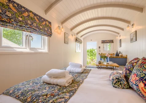 The shepherd's hut bedroom at The Smithy, Feock