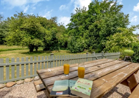 The enclosed gravelled barbecue & alfresco dining area at The Stable, Dunmere