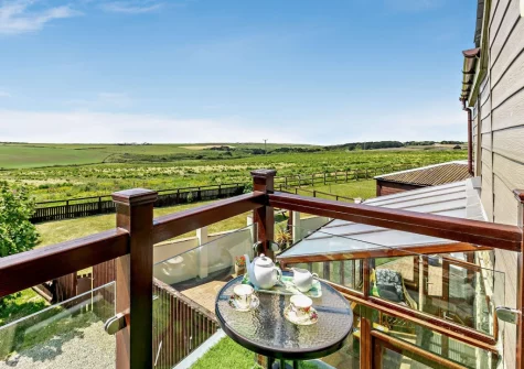 The balcony, with far-reaching countryside views, at The Stables at Brea Farm, Trevegean