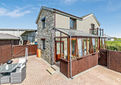 The enclosed terrace, barbecue & alfresco dining area at The Stables at Brea Farm, Trevegean