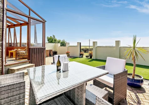 The enclosed terrace, barbecue & alfresco dining area at The Stables at Brea Farm, Trevegean