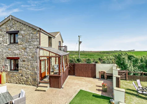 The enclosed terrace, barbecue & alfresco dining area at The Stables at Brea Farm, Trevegean