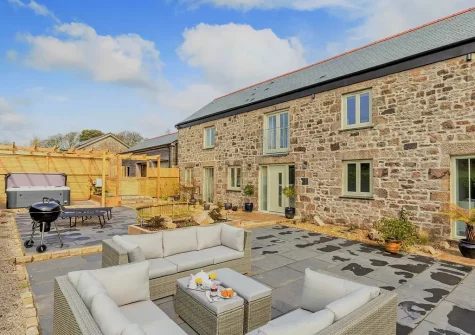 The patio, hot tub & outdoor sitting area at The Stables at Glen View, Burncoose