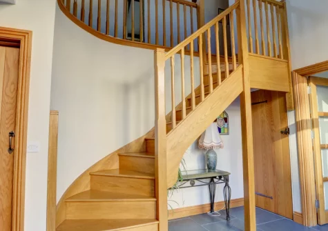 The hallway & stairs up to the first floor at The Stables, Lynton