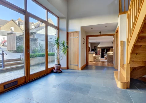 The hallway & stairs up to the first floor at The Stables, Lynton