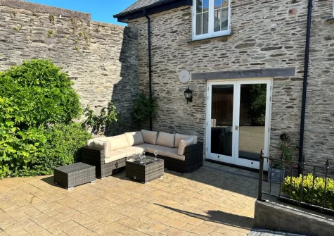 The courtyard garden & outdoor sitting area at The Stables, Lynton