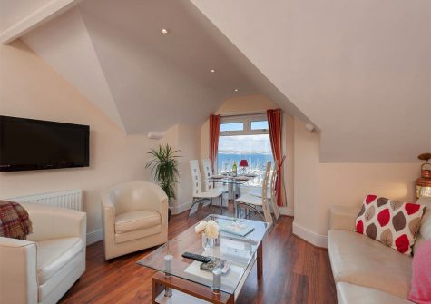 The open-plan living area at The Starfish, 2 Harbour Lights, Brixham