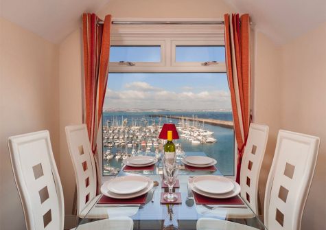The open-plan dining area at The Starfish, 2 Harbour Lights, Brixham