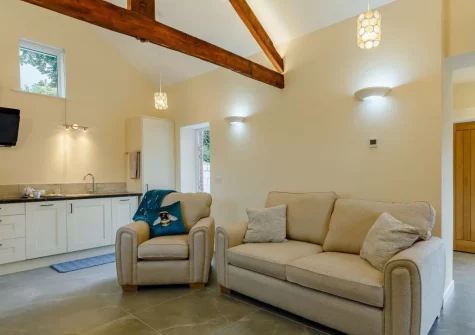 The living area & kitchen at The Stone Barn at Hock Ridge Farm, Fairy Cross