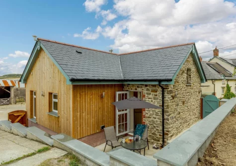 The enclosed courtyard & alfresco dining area at The Stone Barn at Hock Ridge Farm, Fairy Cross