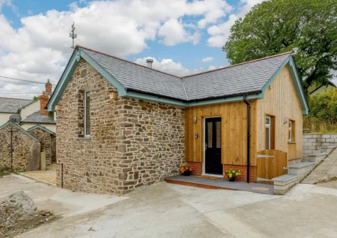 The Stone Barn at Hock Ridge Farm is et on a 6-acre smallholding with chickens, an orchard and the beginnings of a small wood
