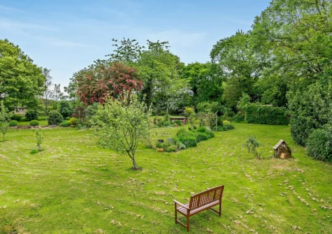 The large shared grassed garden at The Stone Barn, Dulford