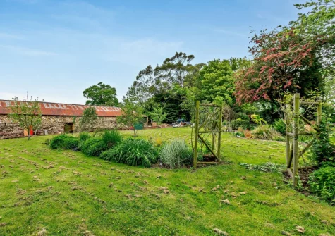 The large shared grassed garden at The Stone Barn, Dulford