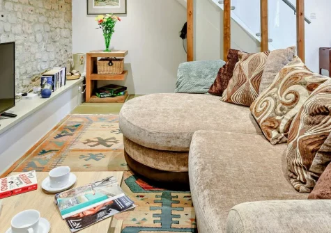 The Stone Barn, Dulford is a beautifully converted one-bedroom retreat in Mid Devon, bursting with character. Stylish interiors, a private courtyard with charcoal BBQ and fire pit, and a dog-friendly garden create the perfect romantic escape.