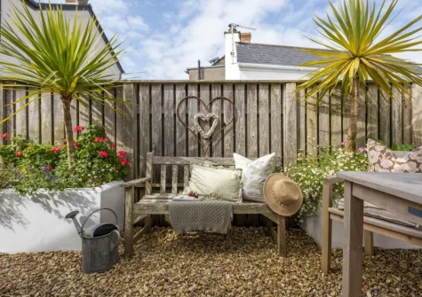 The wrap-around courtyard garden & outdoor sitting area at The Store Room, Mousehole