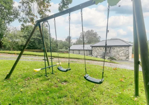 The garden with swing set at The Swallows Barn, Bray Shop