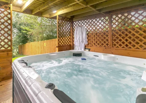 The private covered hot tub at The Swallows Barn, Bray Shop