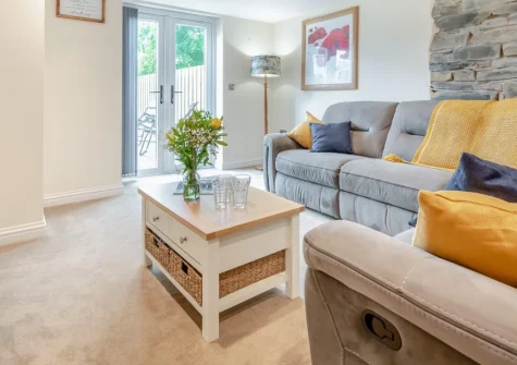 The Swallows Nest, Launceston is a beautifully converted barn on a working farm straddling the Devon/Cornwall border, featuring an original illuminated well, private hot tub with countryside views, and direct access to the Tamar Valley.