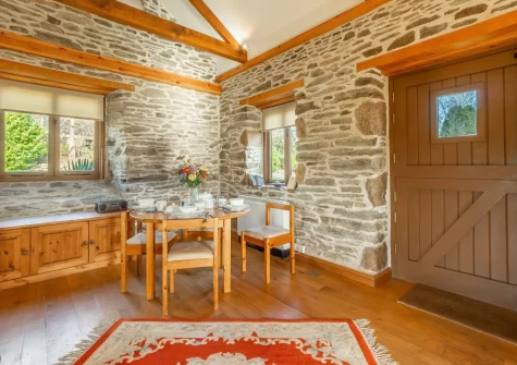 The dining area at The Threshing Barn at Cusgarne Cottages, Cusgarne