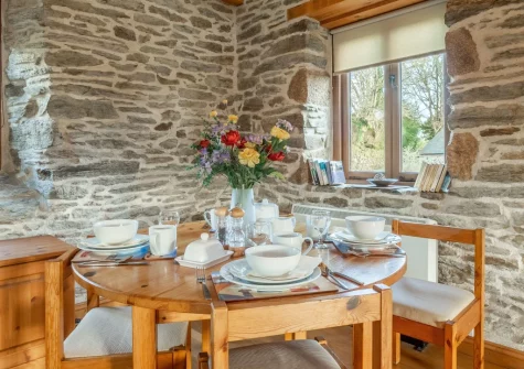 The dining area at The Threshing Barn at Cusgarne Cottages, Cusgarne