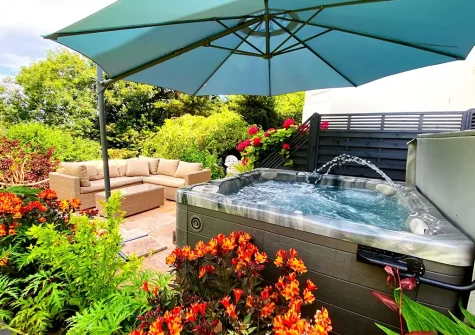 The patio, outdoor sitting area & hot tub at The Town House at Muntham, Torquay