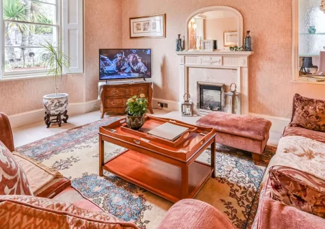 The Town House at Muntham, Torquay, is a luxurious three-storey Victorian villa featuring elegant interiors, private hot tub, and sophisticated living spaces. Perfectly positioned near stunning beaches and attractions for unforgettable holidays.