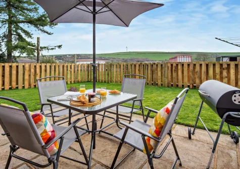 The patio, barbecue & alfresco dining area at The Wash House, Cannalidgey Farm, St Issey
