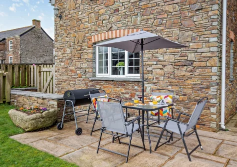 The patio, barbecue & alfresco dining area at The Wash House, Cannalidgey Farm, St Issey