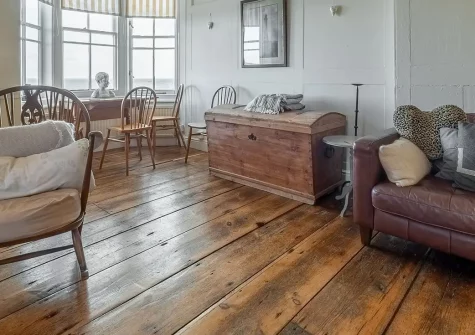 The Watch House, Coverack is a stunning 1810 coastal retreat for six guests. Enjoy spectacular headland views, cosy wood burner, private sea-view gardens, beach access, and authentic period charm, perfect for unforgettable family holidays.