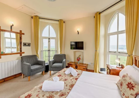 The sitting area & double bed at The Watchtower, Bickington