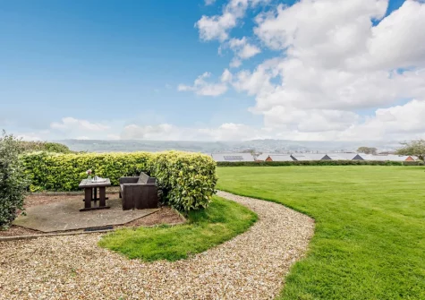 The shared garden & outdoor sitting area at The Watchtower, Bickington