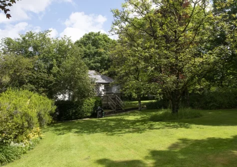 The rear lawned garden at The Watermill, Withiel