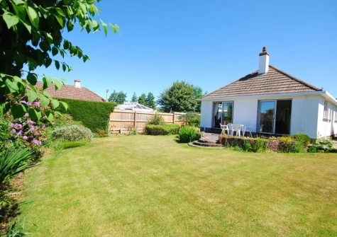 The patio & enclosed rear garden at The Willows, South Molton