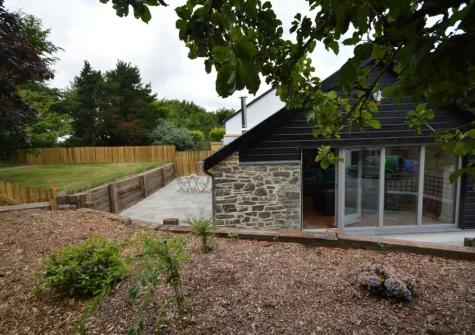 The enclosed garden, patio & outdoor sitting area at The Workshop, High Bickington