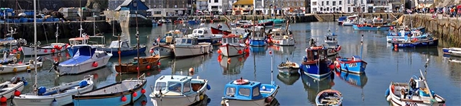 Mid-Cornwall is the most popular area of Cornwall for visitors, stretching along the north coast from Portreath to Mawgan Porth and along the south coast from Falmouth to St Austell. Sandwiched between is a meaty and substantial filling of rural countryside, river valleys and the county capital, Truro, along with Newquay, Perranporth, St Mawes and Mevagissey.