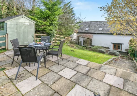 The patio, alfresco dining area & garden at Thistledown Cottage, Poughill