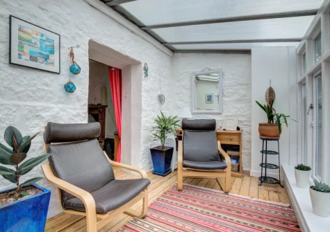 The sunny conservatory at Three Blind Mice, Mousehole