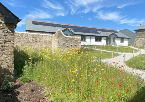 Three Corners Barn is a stylish semi-detached barn set within a pretty courtyard with a large, enclosed garden & sea views