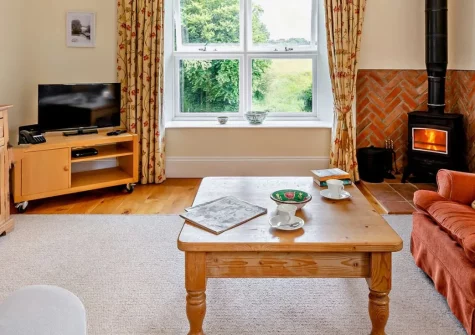 Threshers Barn, East Anstey is a charming converted barn retreat on the edge of Exmoor National Park, set in 20 acres of private countryside with exposed beams, a cosy wood burner, and peaceful views, perfect for exploring the moors and beyond.