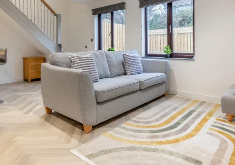 Tide and Seek, Padstow is a cheerful two-bedroom cottage just half a mile from the harbour, shops and pubs, boasting a sleek open-plan kitchen-lounge, pretty patio garden, and easy access to the Seven Bays beaches and Padstow's coastal charm.