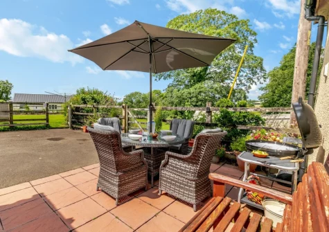 The patio, barbecue & alfresco dining area at Tillislow Barn, Virginstow