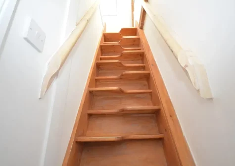 Steep ship-style steps up to bedroom #1 at Tolcarne Cottage, Newquay