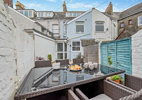 The decked courtyard & alfresco dining area at Tolcarne Cottage, Newquay